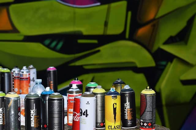 used spray cans- graffiti background
