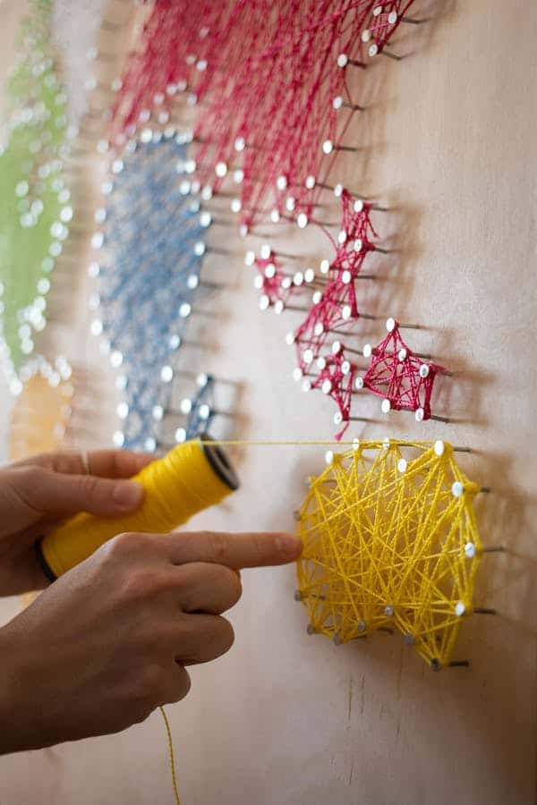 string-art-coloured-string-wrapped-around-nails.